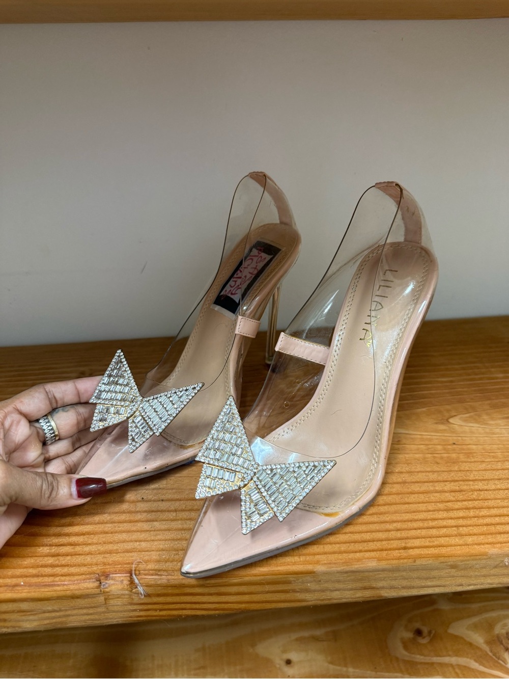 Liliana Nude Pointed-Toe Clear Slingback Heels with Crystal Bow Accent